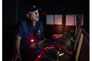 In 2019, Nautilus plied the Pacific waters off the island of Nikumaroro, searching for any sign of Amelia Earhart's lost plane. In the cool, dark control room, we kept a 24-hour vigil. (Gabriel Scarlett/National Geographic Image Collection)