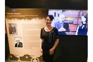 Dawn Massa Stancavish standing in front of a display at the Reagan National Library’s “Secrets of WWII” exhibit honoring her grandfather, Frank Massa. Photo courtesy Massa
