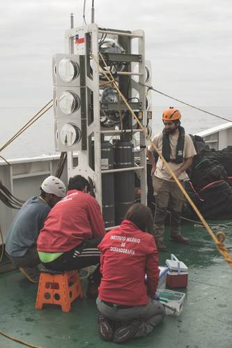 Figure 6: Chilean marine scientists collect samples from the benthic lander Audacia after its third trip to the trench floor, reaching 8081m. (Image: Courtesy Kevin Hardy and Atacamex 2018)