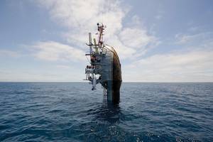 The FLIP Side 55 ft. remain visible after the crew of the Floating Instrument Platform (FLIP) partially flood the ballast tanks causing the vessel to turn stern first into the ocean. The 355-ft. research vessel is owned by the Office of Naval Research and is operated by the Marine Physical Laboratory at Scripps Institution of Oceanography at University of California.  (U.S. Navy photo by John F. Williams/Released) 
